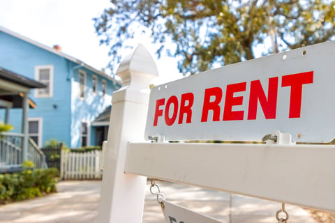 House for rent sign showing real estate investment opportunity